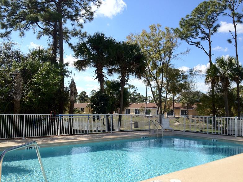 Tropical pool and sun deck at Cortez Village Townhomes